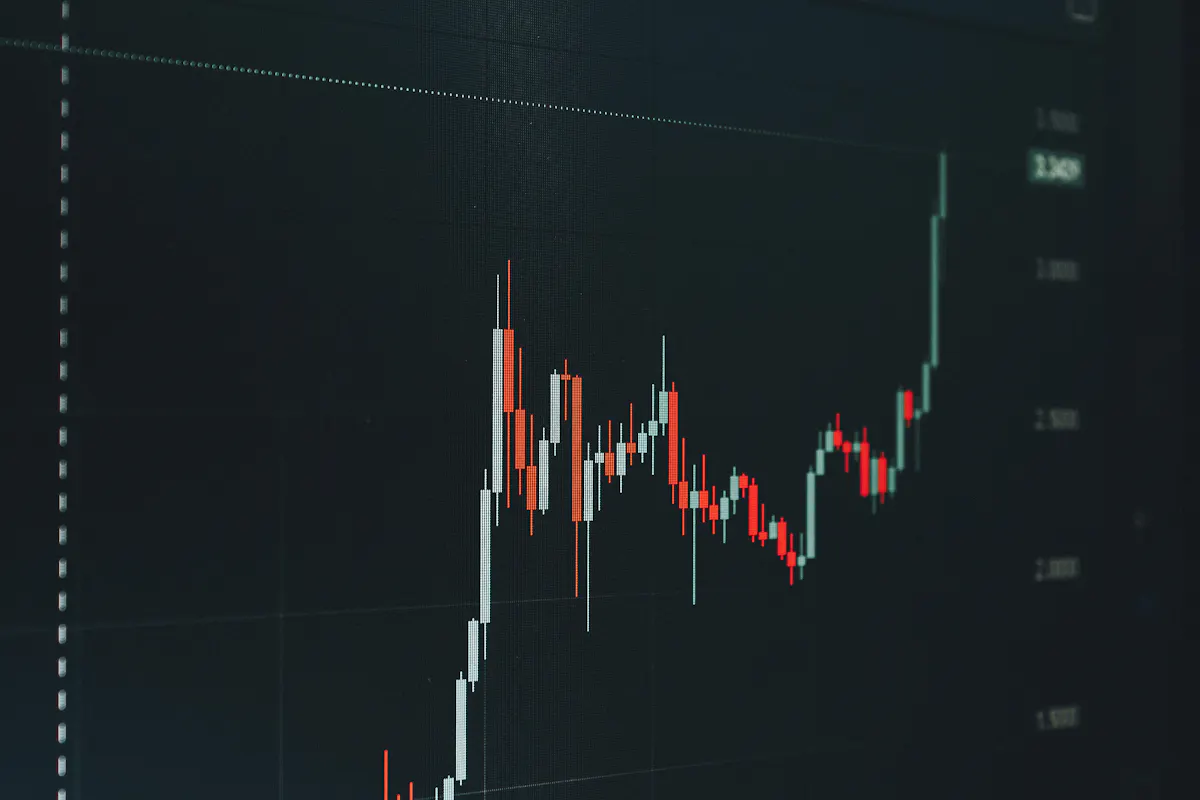 Financial chart showing an upward price trend on a dark screen