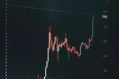 Financial chart showing an upward price trend on a dark screen