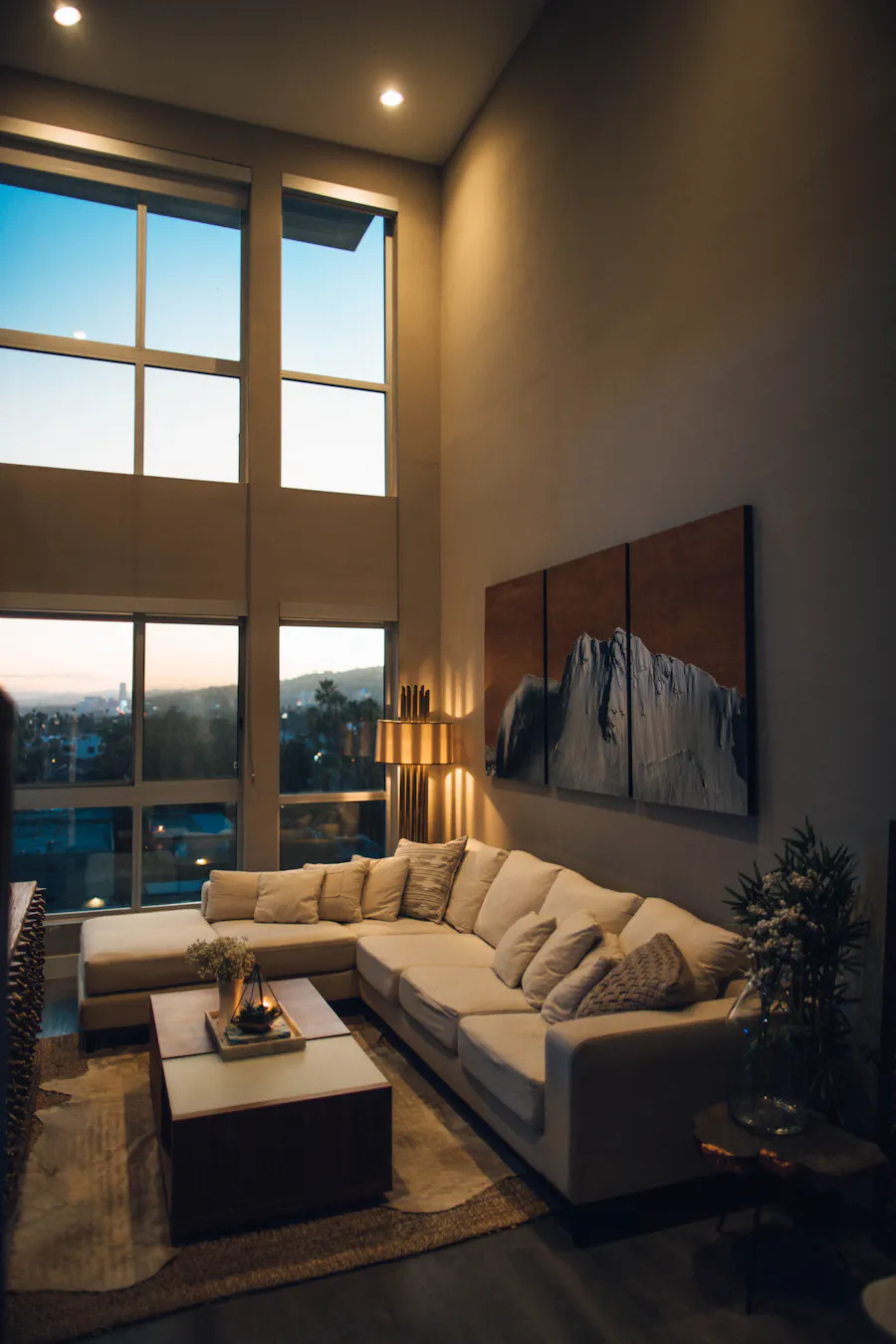 Premium living room interior with a city view at dusk