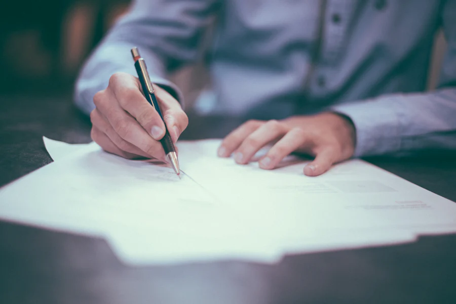 Signing property contract documents with a pen