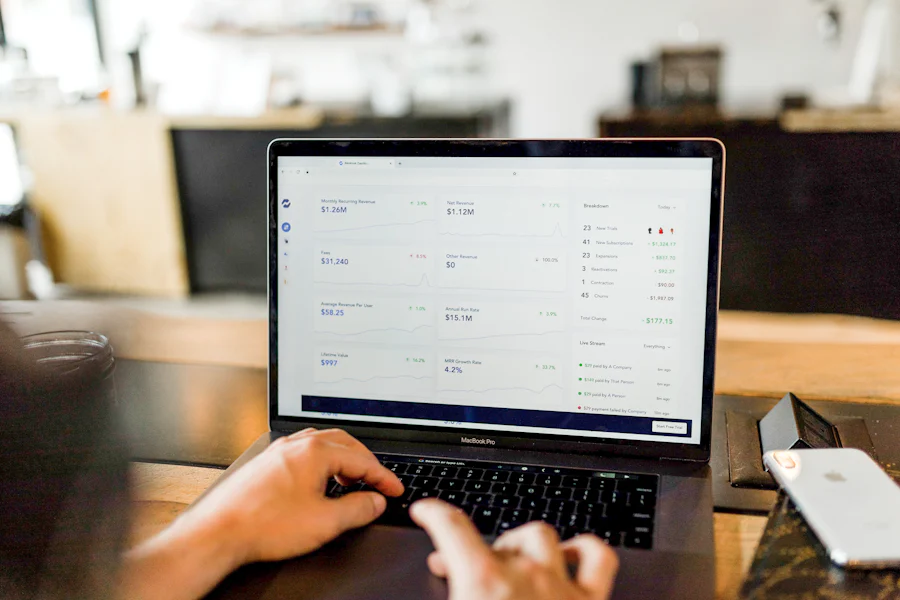 Hands on a laptop reviewing rental income figures